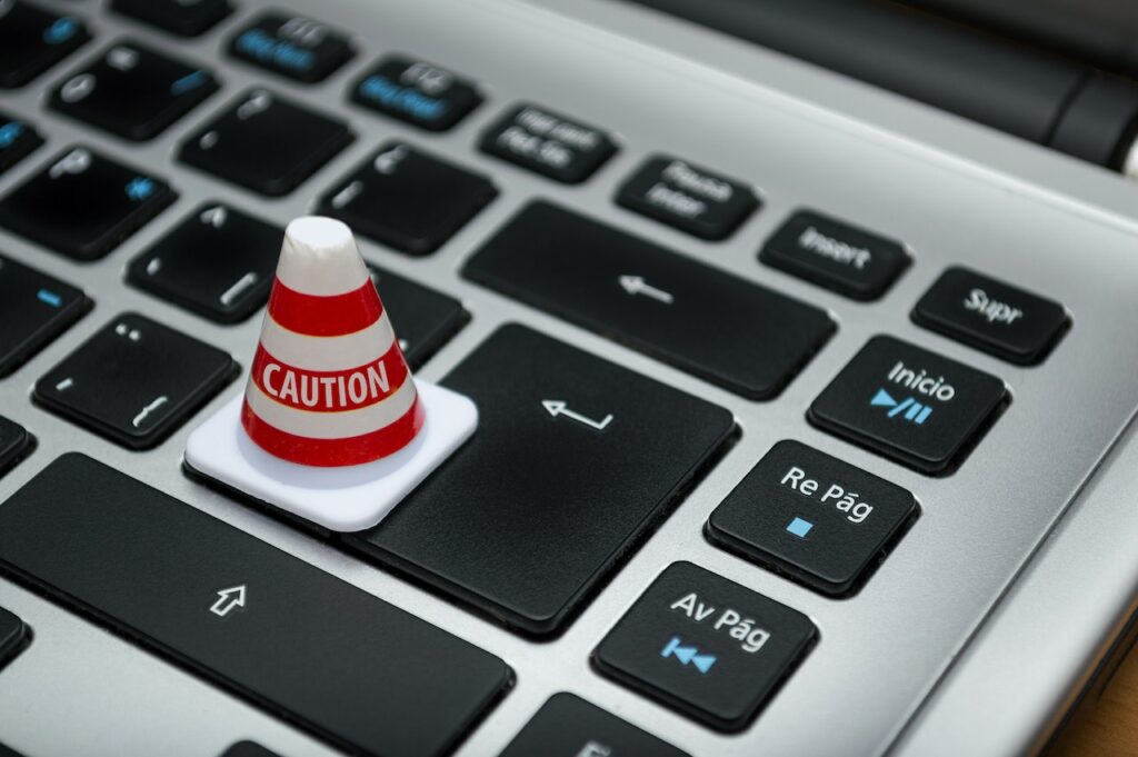 Photo by Fernando Arcos: https://www.pexels.com/photo/white-caution-cone-on-keyboard-211151/